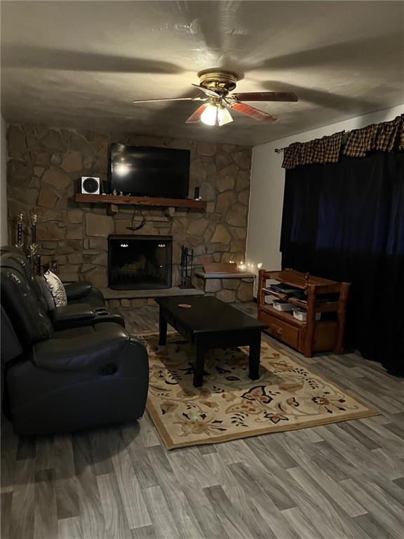 145 Coffman Road Acme, PA 15610 - Photo 3 of 37 a living room with furniture a flat screen tv and a fireplace