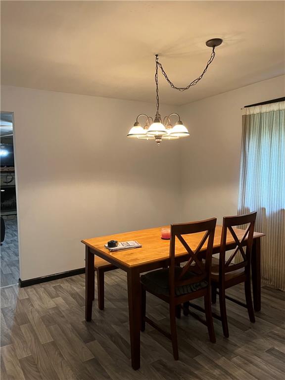 145 Coffman Road Acme, PA 15610 - Photo 6 of 37 a room with a table chairs and wooden floor