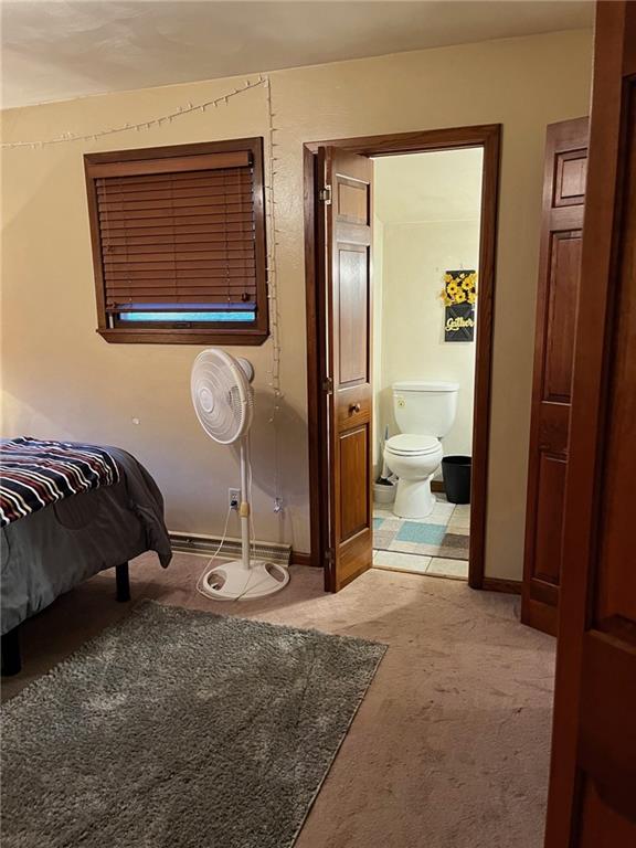 145 Coffman Road Acme, PA 15610 - Photo 9 of 37 a bedroom with a bed and a mirror