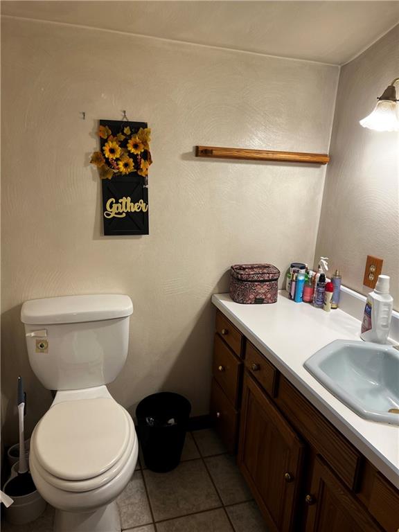 145 Coffman Road Acme, PA 15610 - Photo 10 of 37 a bathroom with a toilet sink and mirror