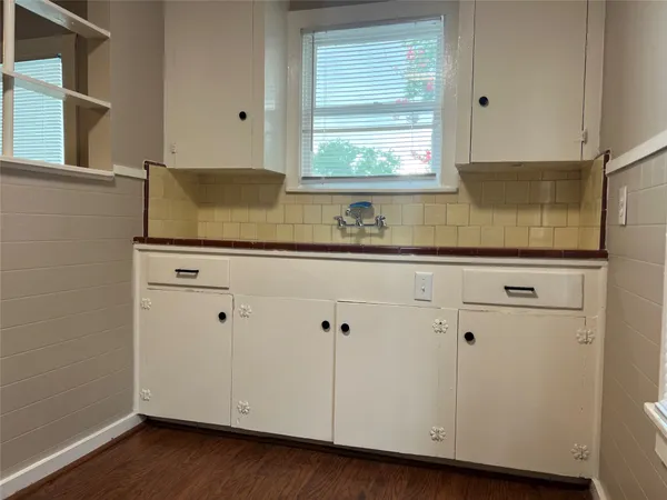 a view of cabinets and window