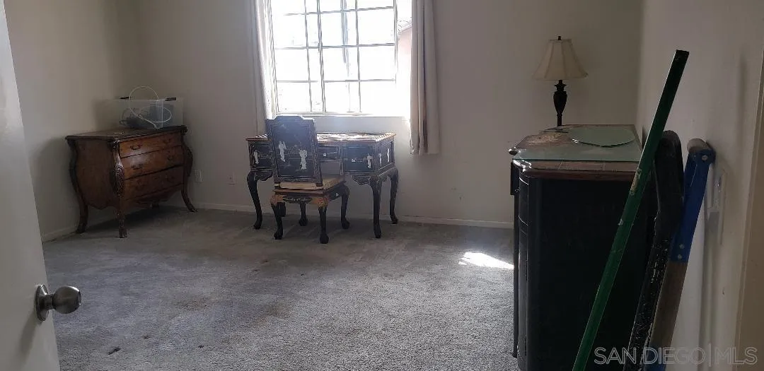 17161 Alva Road, Unit 1424 San Diego, CA 92127 - Photo 3 of 10 a view of a workspace with furniture and a window