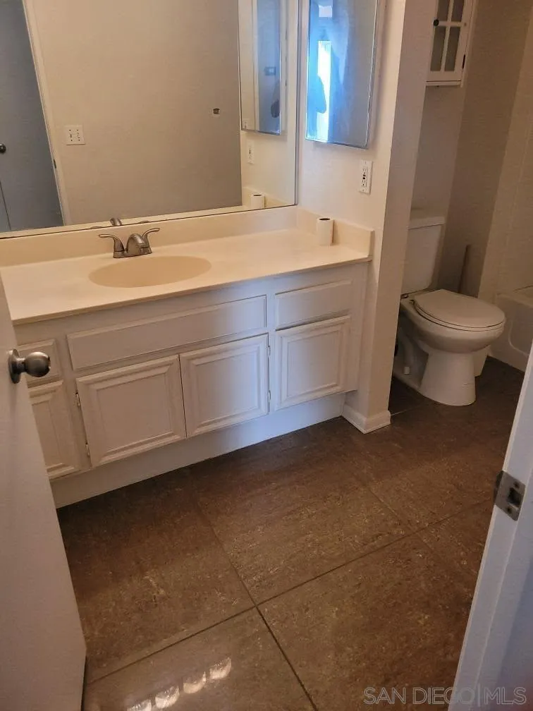 17161 Alva Road, Unit 1424 San Diego, CA 92127 - Photo 4 of 10 a bathroom with a sink and a toilet