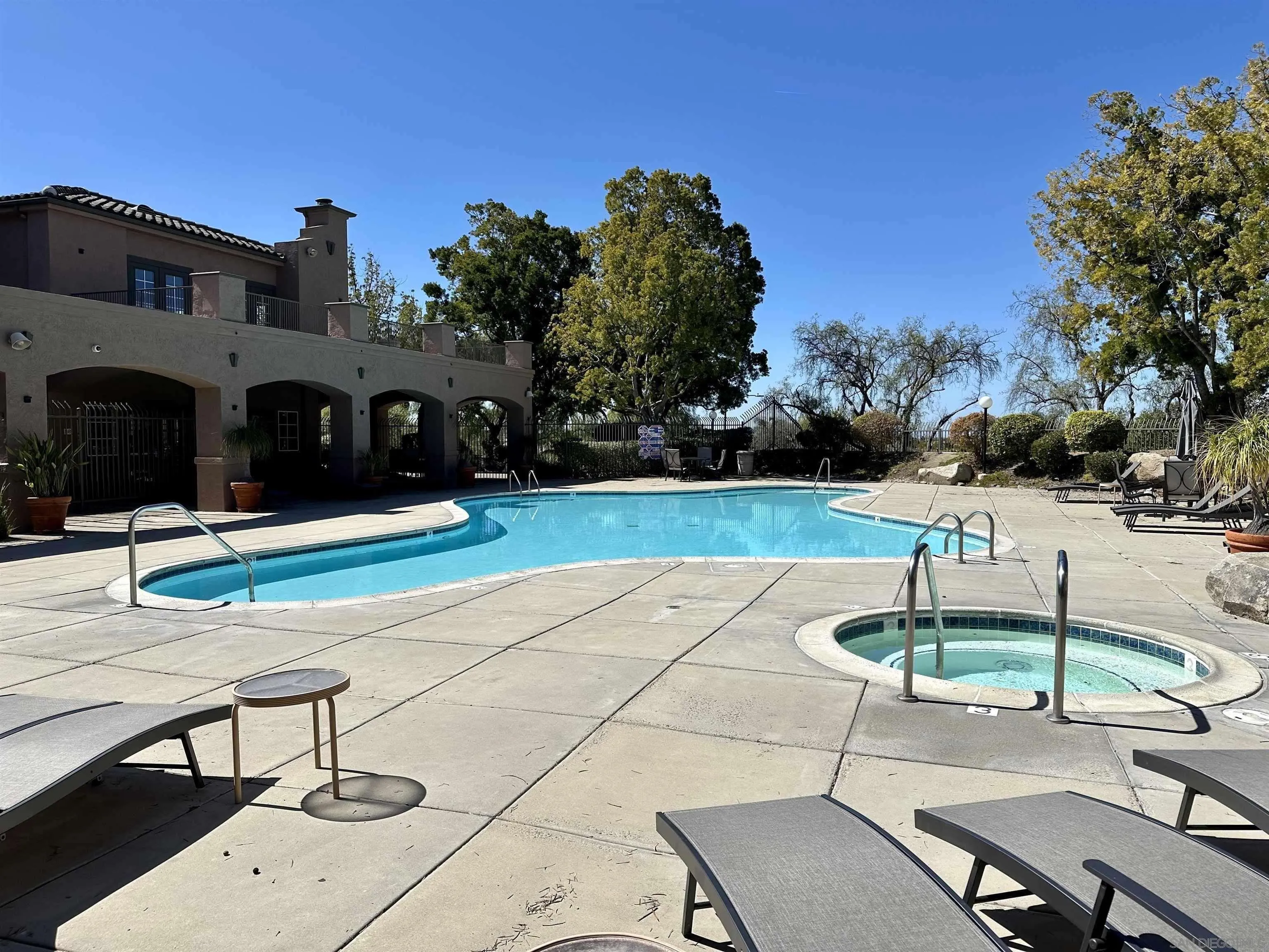 17161 Alva Road, Unit 1424 San Diego, CA 92127 - Photo 9 of 10 a view of a tennis ground with large trees