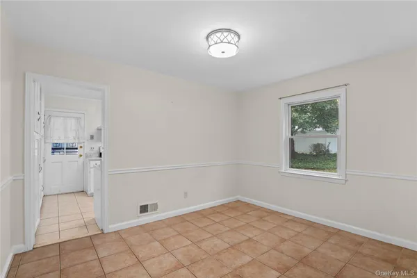 a view of a room that has a window in it