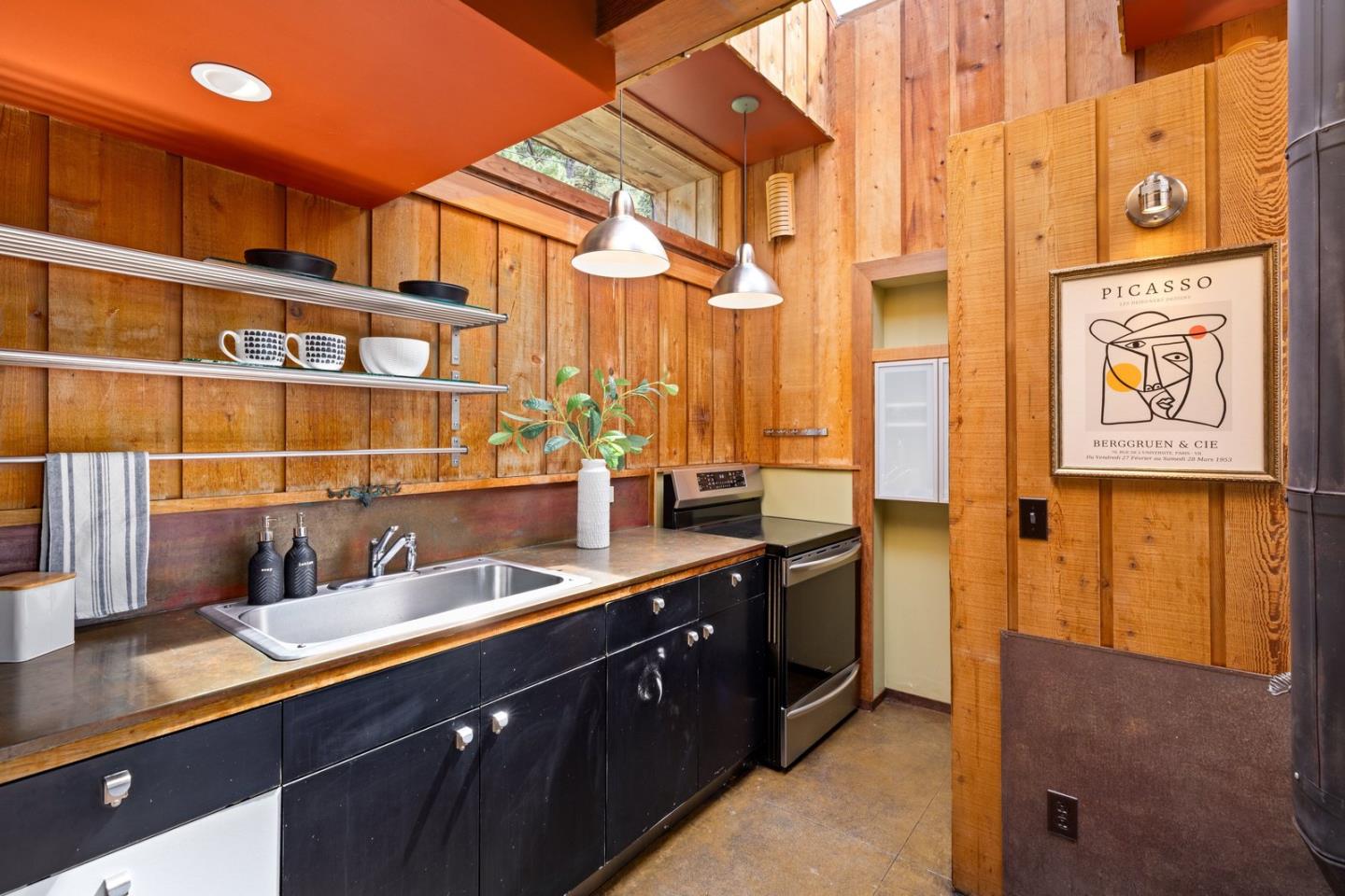 73 Mt Devon Road Carmel Highlands, CA 93923 - Photo 72 of 88 a kitchen with a sink and a refrigerator