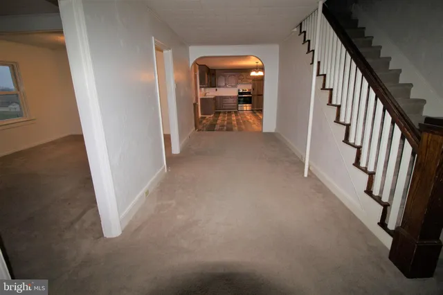 a view of a livingroom from a hallway