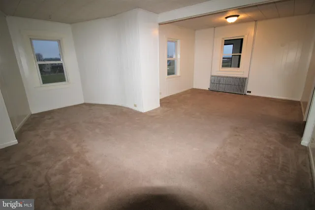 a view of empty room with windows