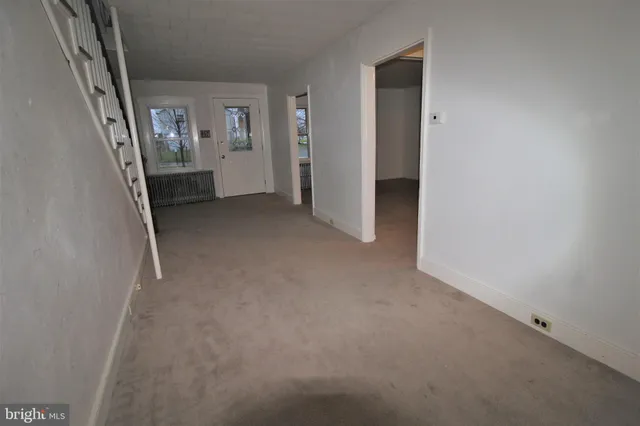 a view of kitchen with sink and wooden floor