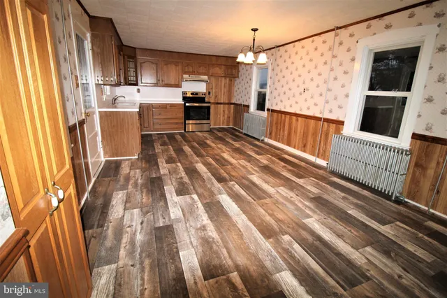 a spacious bathroom with a sink and a mirror