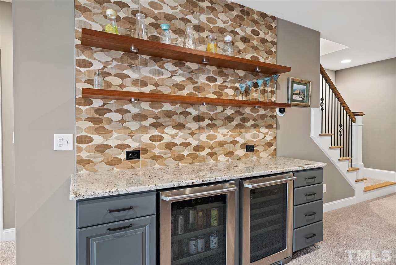 5208 Woodall Way Raleigh, NC 27613 - Photo 22 of 30 a stove top oven sitting inside of a kitchen