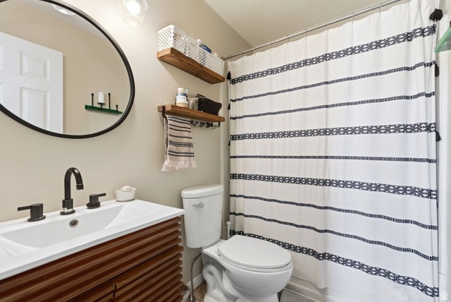 515 Inverness Lane, Unit 207 Heber City, UT 84032 - Photo 14 of 26 Bathroom with vanity and a shower with curtain