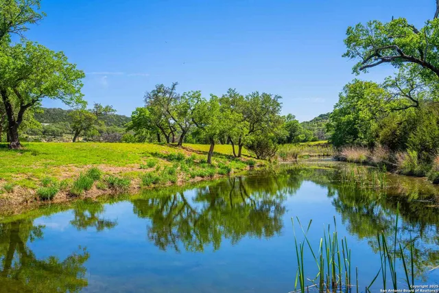a view of a lake with a big yard