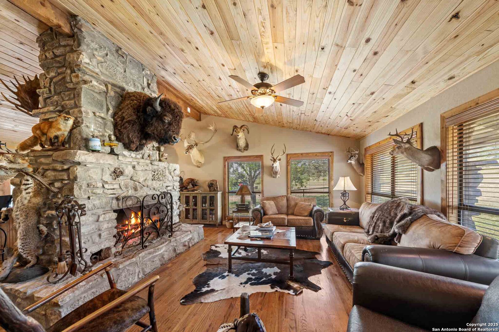 171 Flach Road Comfort, TX 78013 - Photo 30 of 91 a living room with fireplace furniture flat screen tv and a fireplace