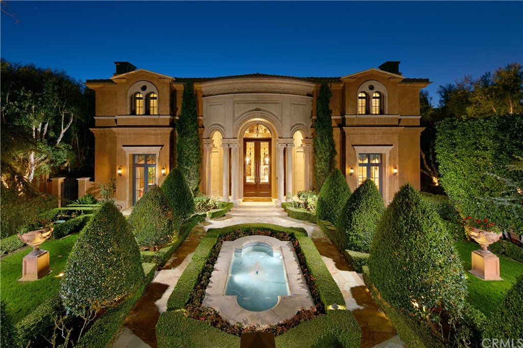 front view of a house with a garden