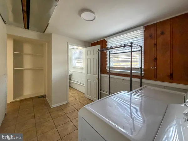 a kitchen with stainless steel appliances granite countertop a refrigerator and a stove