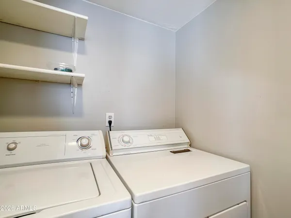 a utility room with dryer and washer