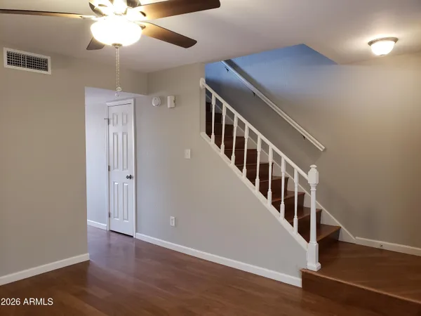 a view of an entryway with wooden floor
