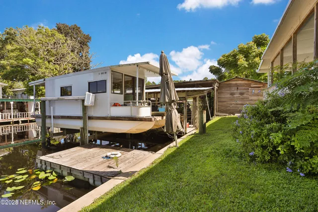 a view of a chairs and table in deck