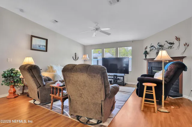 a kitchen with a table chairs and a refrigerator