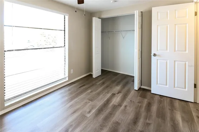 an empty room with wooden door