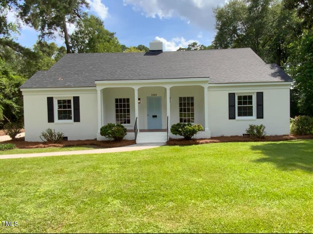 1101 West Divine Street Dunn, NC 28334 - Photo 1 of 36 front view of a house with a yard
