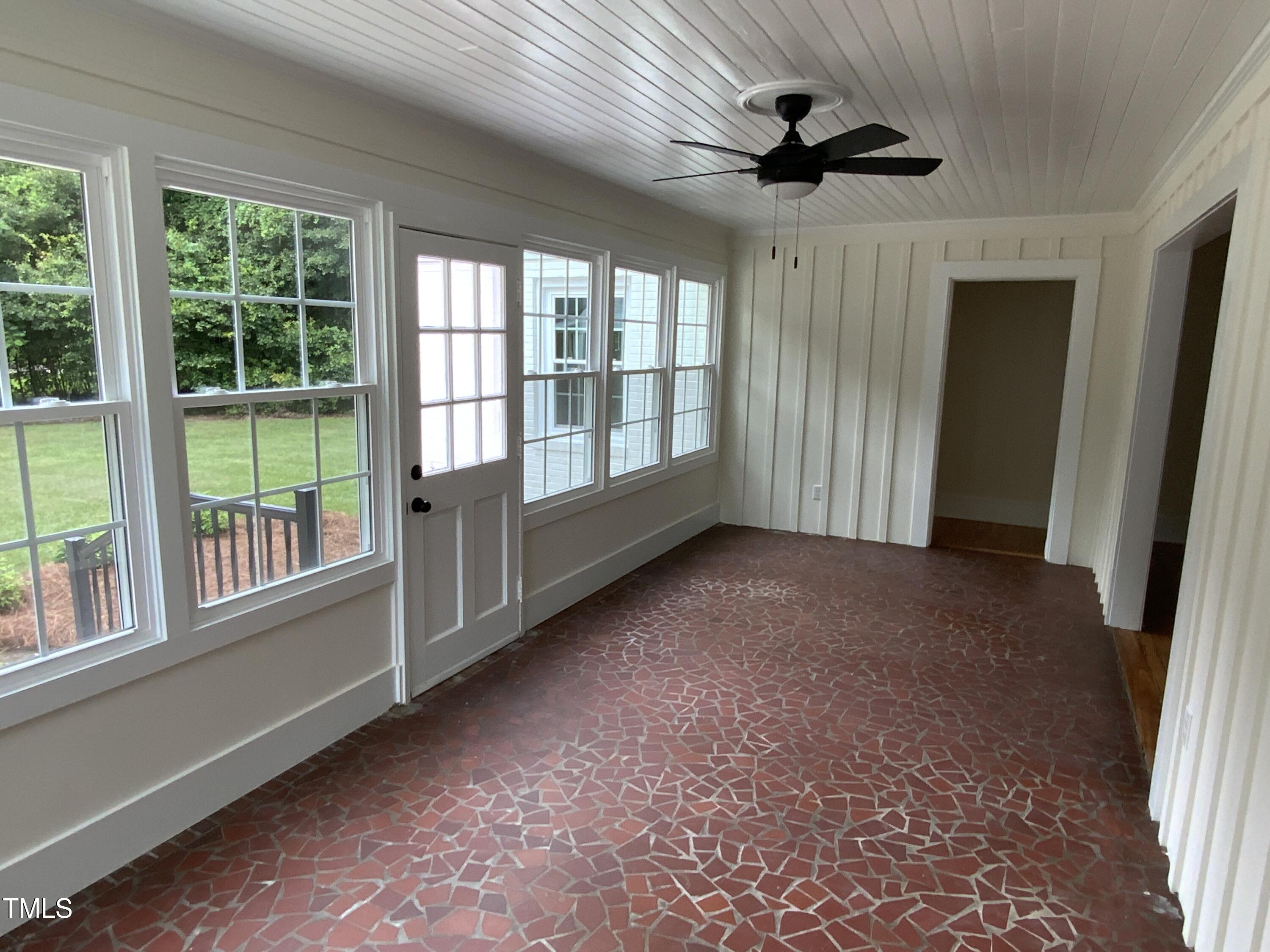 1101 West Divine Street Dunn, NC 28334 - Photo 27 of 36 an empty room with windows