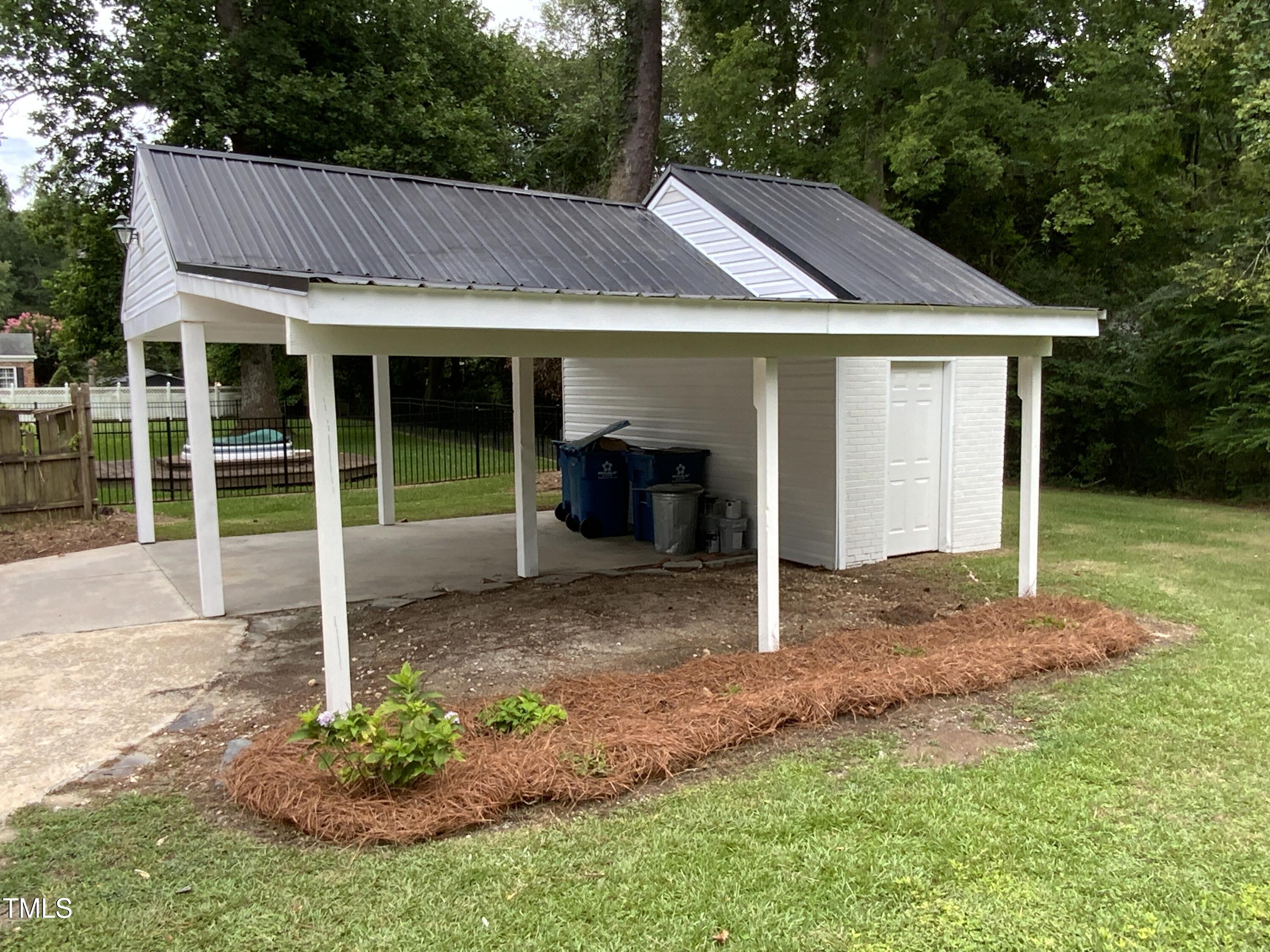 1101 West Divine Street Dunn, NC 28334 - Photo 31 of 36 a view of a house with a yard and sitting area