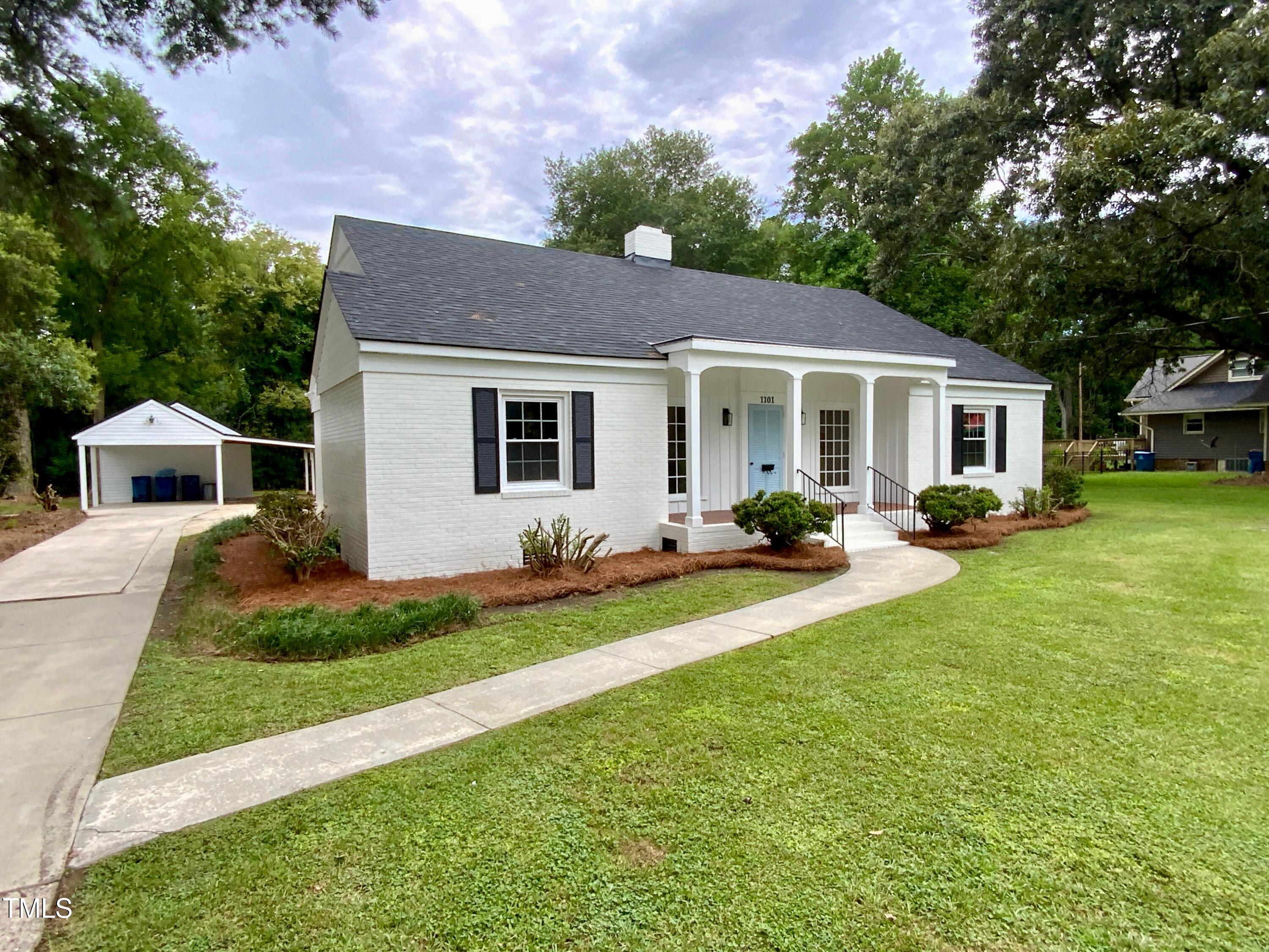 1101 West Divine Street Dunn, NC 28334 - Photo 33 of 36 a front view of house with yard and green space