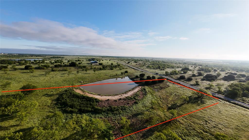 1009 Goodnight Trail Perrin, TX 76486 - Photo 2 of 14 an aerial view of a house with a yard and lake view