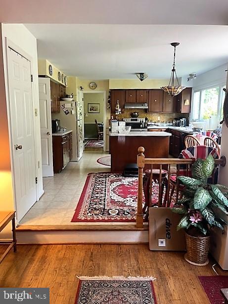 51 Moore Lane Falling Waters, WV 25419 - Photo 14 of 47 a open kitchen with stainless steel appliances granite countertop a rug stove and refrigerator