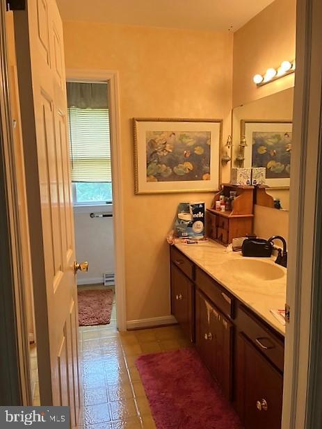 51 Moore Lane Falling Waters, WV 25419 - Photo 32 of 47 a view of bathroom with a sink mirror and a window