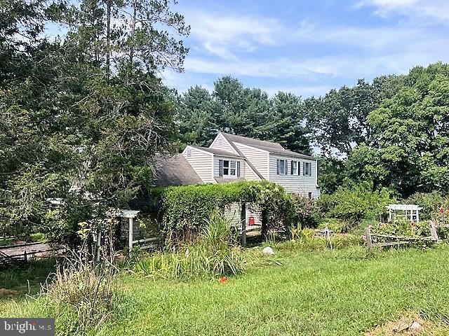 51 Moore Lane Falling Waters, WV 25419 - Photo 7 of 47 a front view of a house with a yard
