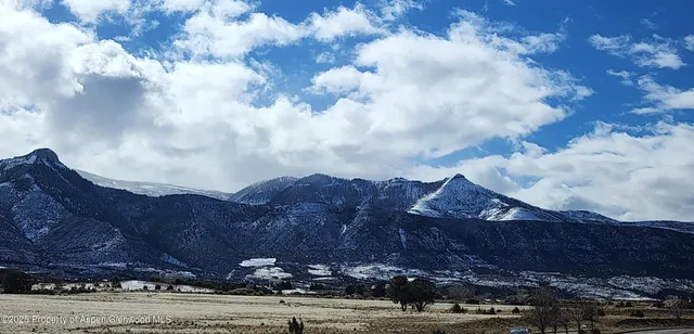 a view of house with mountain view