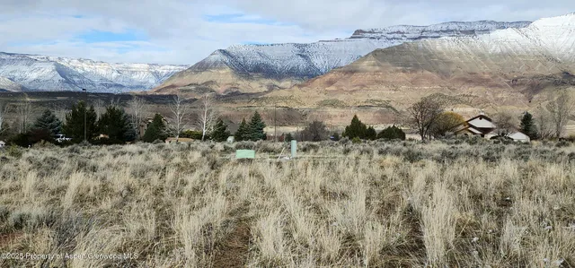 a view of a backyard of the house