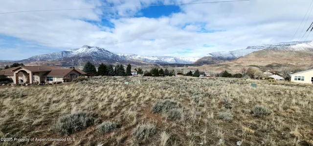 a view of a town with mountains in the background