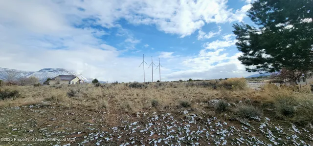 a view of a field of mountains and valleys