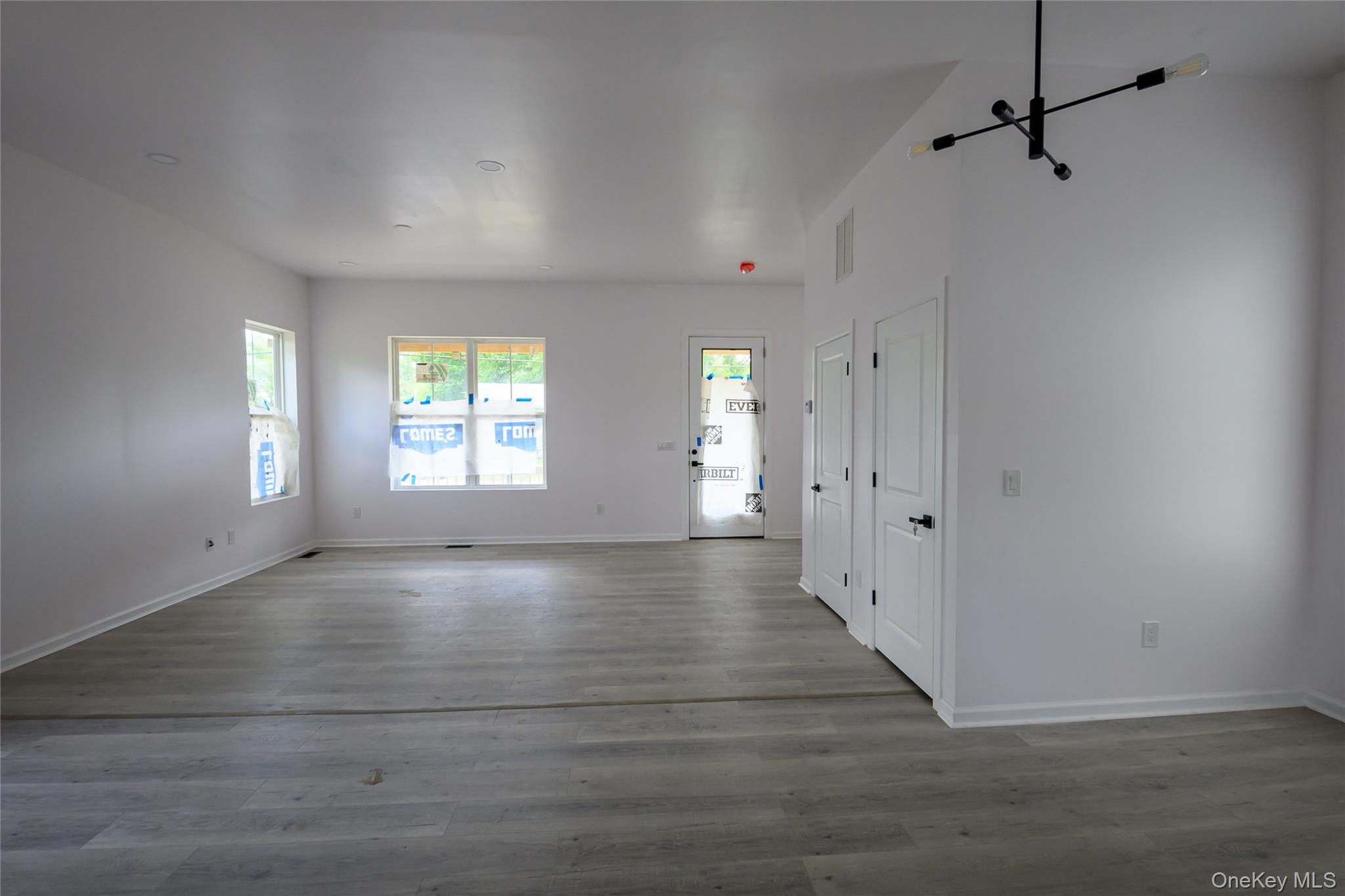 81 Silver Lake Sctn Road Middletown, NY 10940 - Photo 35 of 37 a view of an empty room with wooden floor and a window
