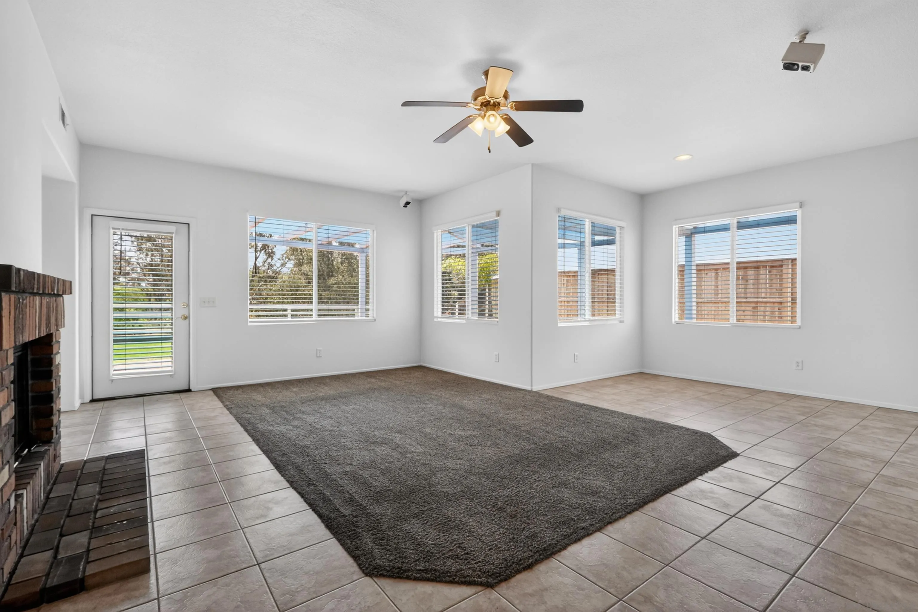 1432 Belmont Park Road Oceanside, CA 92057 - Photo 23 of 54 a view of livingroom with hardwood floor and a ceiling fan