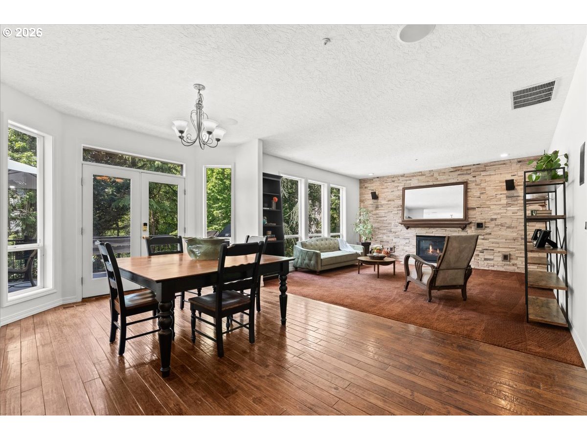 12431 Southwest 55th Place Portland, OR 97219 - Photo 7 of 40 a view of a dining room with furniture and wooden floor