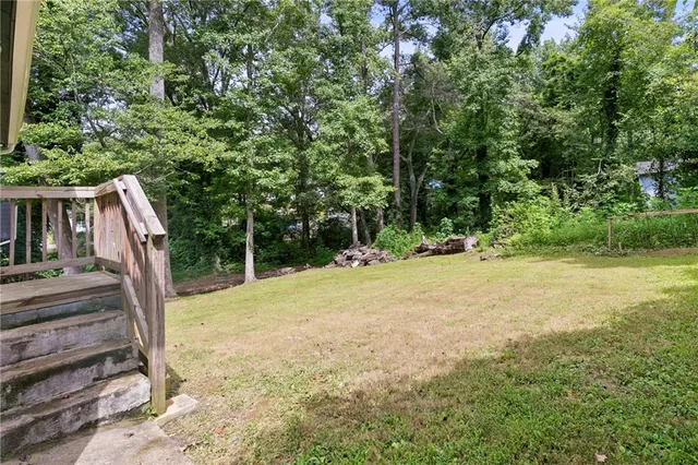 a view of backyard with green space