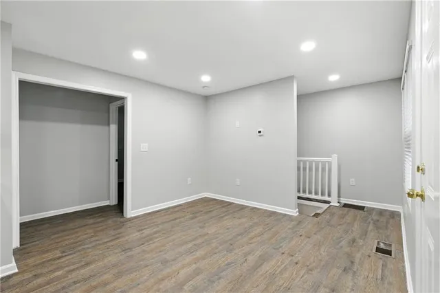 a view of a livingroom with wooden floor