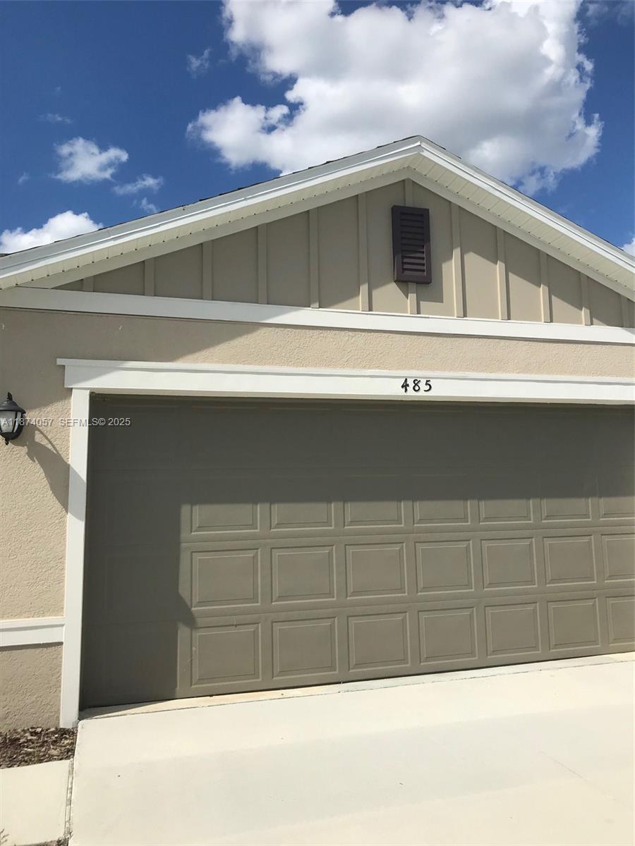 485 Overpool Avenue, Unit 485 Davenport, FL 33896 - Photo 2 of 12 a view of a house with a garage
