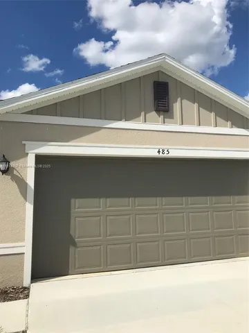 a view of a house with a garage
