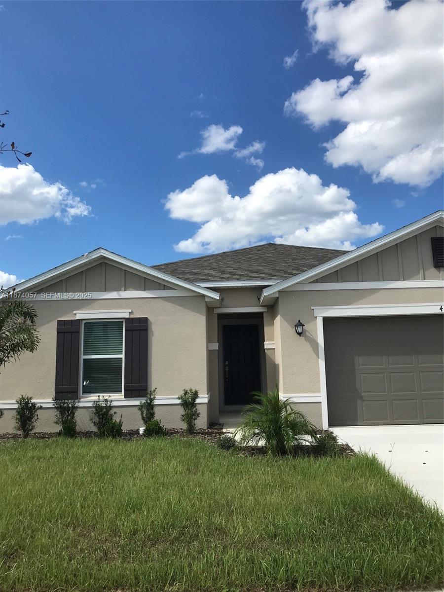 485 Overpool Avenue, Unit 485 Davenport, FL 33896 - Photo 3 of 12 a front view of house with yard and green space