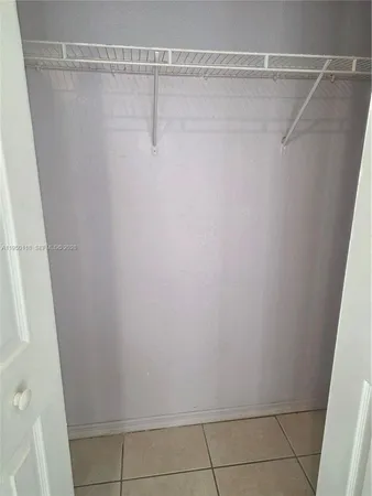 a bathroom with a granite countertop toilet a sink and bathtub