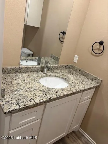 a view of a pathway door with wooden fence