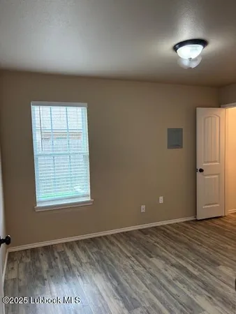 a view of a backyard with a wooden fence