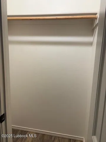 a room with a sink and a mirror