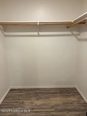 a bedroom with a bed and a mirror